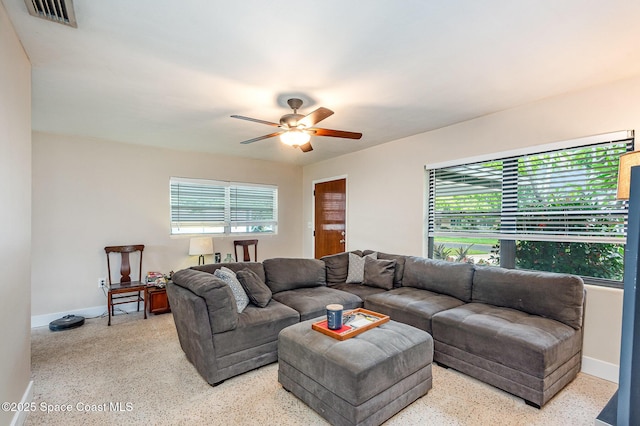 311 3rd St, Merritt Island, FL 32953 - living room featuring healthy amount of natural light, ceiling fan, speckled floor, and baseboards