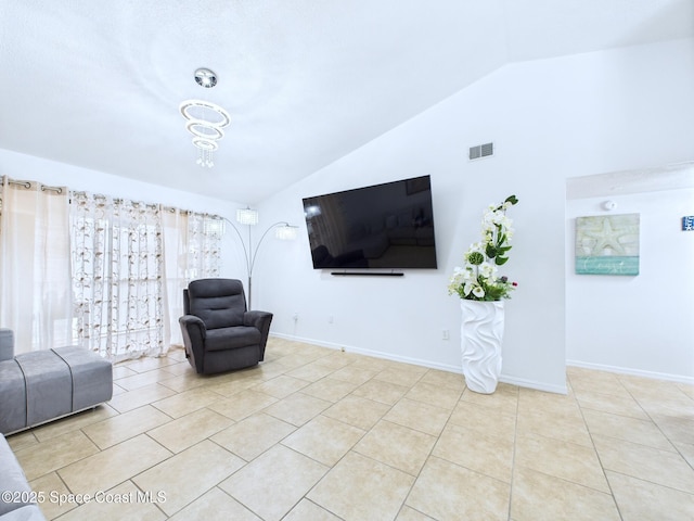 1515 Huntington Ln Unit 924, Rockledge, FL 32955 - living room with lofted ceiling, tile patterned flooring, and baseboards