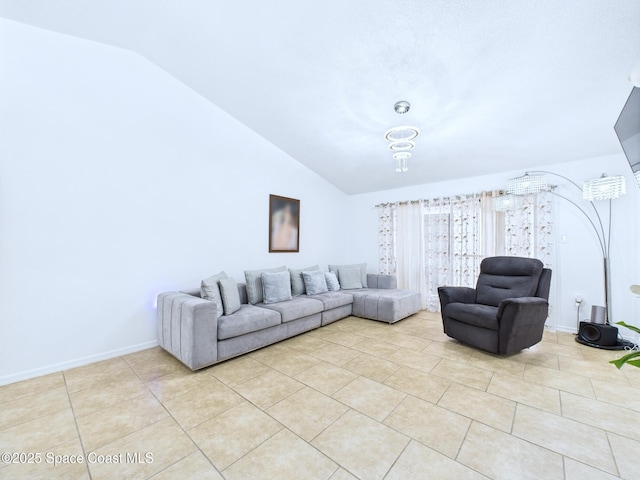 1515 Huntington Ln Unit 924, Rockledge, FL 32955 - living area with lofted ceiling, light tile patterned floors, and baseboards