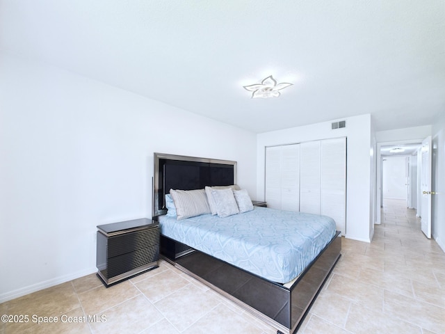 1515 Huntington Ln Unit 924, Rockledge, FL 32955 - bedroom with a closet, light tile patterned floors, and baseboards