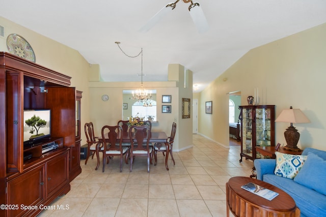 1790 Seeley Cir NW, Palm Bay, FL 32907 - dining area with a chandelier, light tile patterned floors, lofted ceiling, and ceiling fan