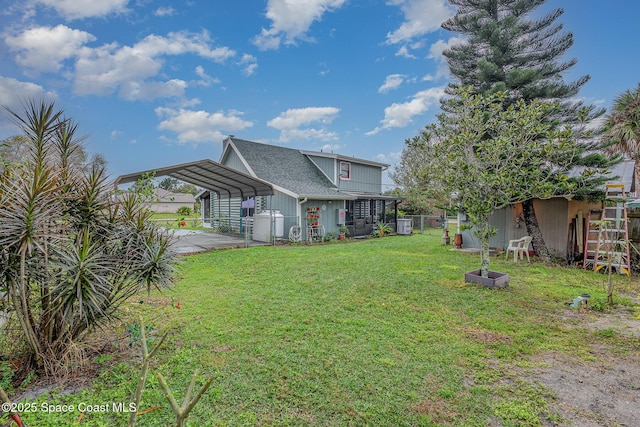 4390 Everglades St, Cocoa, FL 32927 - view of yard with a carport and driveway