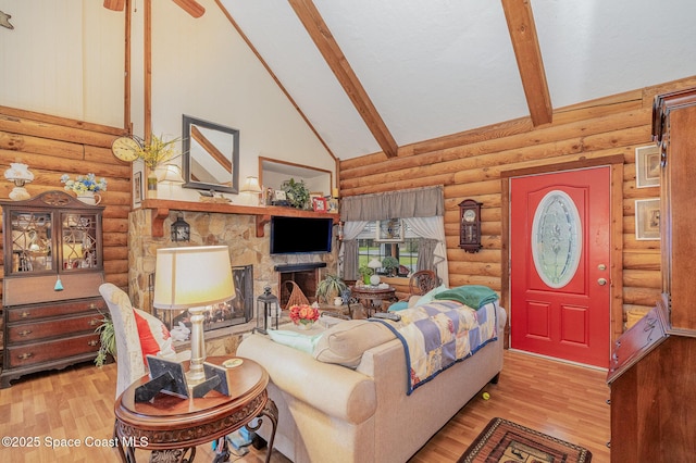 4390 Everglades St, Cocoa, FL 32927 - living area with beam ceiling, log walls, wood finished floors, a fireplace, and high vaulted ceiling