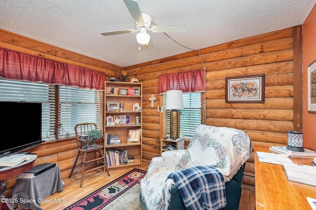 4390 Everglades St, Cocoa, FL 32927 - office space with wood finished floors, rustic walls, a textured ceiling, and a ceiling fan
