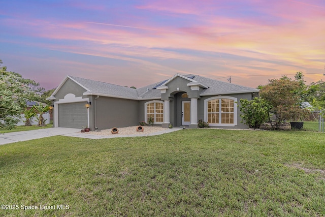 251 District St SE, Palm Bay, FL 32909 - single story home with stucco siding, a garage, and concrete driveway