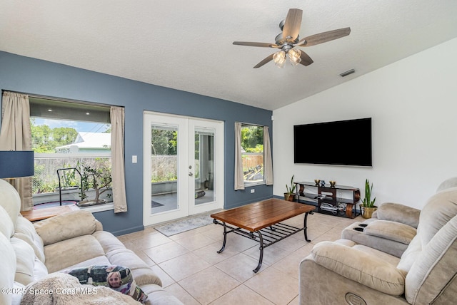 251 District St SE, Palm Bay, FL 32909 - living area with lofted ceiling, french doors, light tile patterned floors, ceiling fan, and a textured ceiling