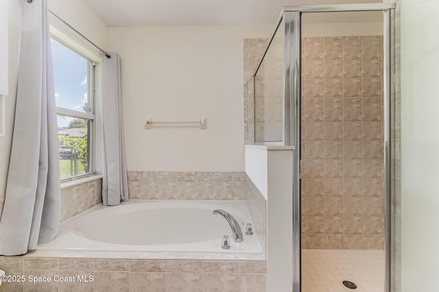 251 District St SE, Palm Bay, FL 32909 - bathroom with a stall shower and a garden tub
