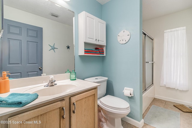 251 District St SE, Palm Bay, FL 32909 - bathroom featuring vanity, toilet, tile patterned flooring, baseboards, and bath / shower combo with glass door