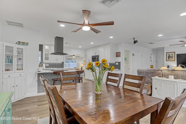 326 Coral Dr, Cape Canaveral, FL 32920 - dining room featuring a ceiling fan, light wood finished floors, and recessed lighting