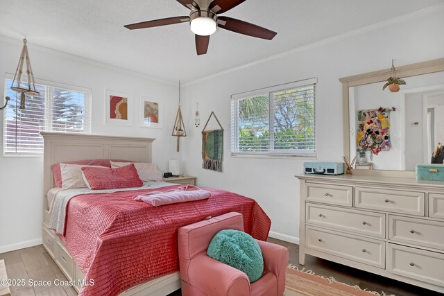 326 Coral Dr, Cape Canaveral, FL 32920 - bedroom featuring multiple windows, baseboards, crown molding, and ceiling fan