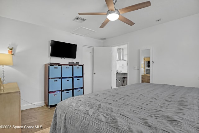 326 Coral Dr, Cape Canaveral, FL 32920 - bedroom featuring light wood finished floors, attic access, baseboards, and ceiling fan