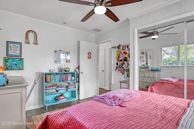 326 Coral Dr, Cape Canaveral, FL 32920 - bedroom with wood finished floors, ornamental molding, and ceiling fan