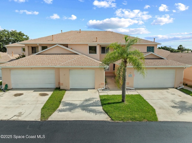 243 Forecast Ln Unit 4-21, Rockledge, FL 32955 - view of property featuring stucco siding, concrete driveway, and roof with shingles