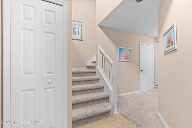243 Forecast Ln Unit 4-21, Rockledge, FL 32955 - stairs featuring carpet and baseboards