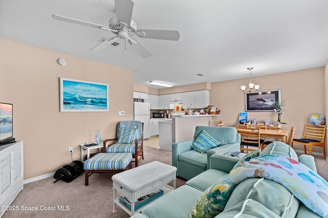 243 Forecast Ln Unit 4-21, Rockledge, FL 32955 - living room with light colored carpet, a chandelier, a ceiling fan, and baseboards