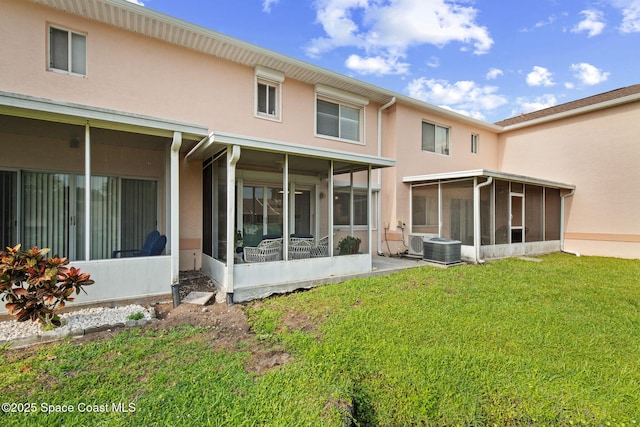 243 Forecast Ln Unit 4-21, Rockledge, FL 32955 - back of house featuring a sunroom, stucco siding, a yard, and cooling unit