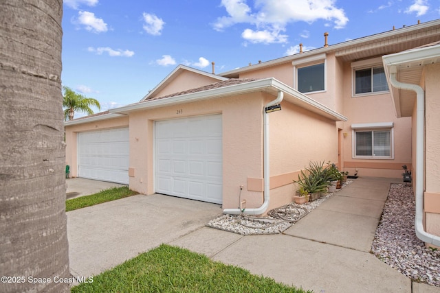 243 Forecast Ln Unit 4-21, Rockledge, FL 32955 - view of front of home featuring stucco siding and concrete driveway
