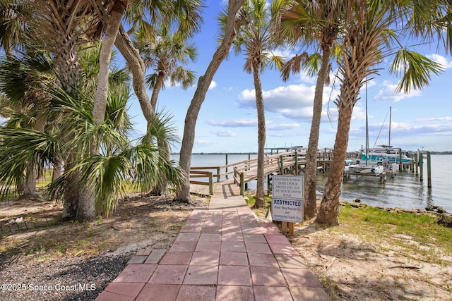 243 Forecast Ln Unit 4-21, Rockledge, FL 32955 - view of property's community with a water view, a boat dock, and boat lift
