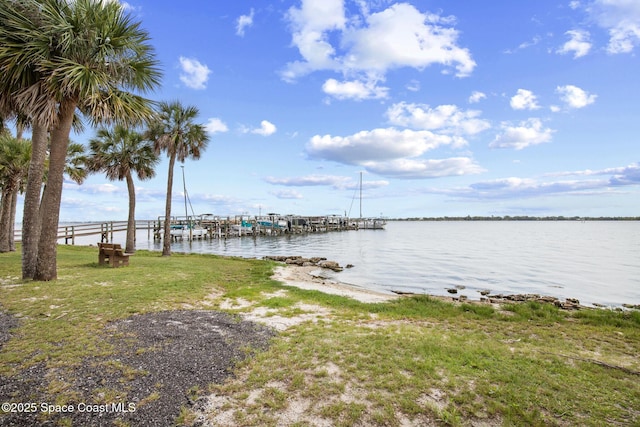 243 Forecast Ln Unit 4-21, Rockledge, FL 32955 - dock area with a water view, boat lift, and a yard