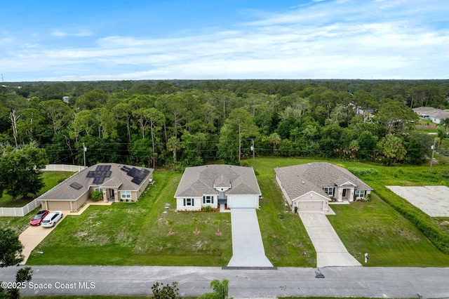 1427 Damon Rd SE, Palm Bay, FL 32909 - aerial view of property and surrounding area featuring a heavily wooded area