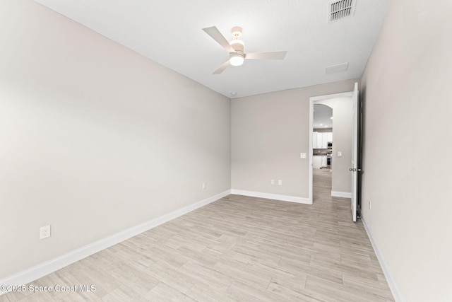 1427 Damon Rd SE, Palm Bay, FL 32909 - unfurnished room featuring a ceiling fan, baseboards, and light wood finished floors