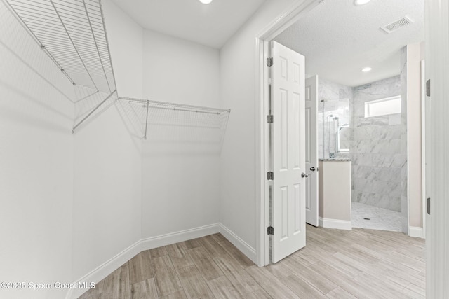 1427 Damon Rd SE, Palm Bay, FL 32909 - spacious closet featuring light wood-style floors