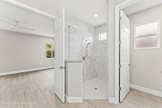 1427 Damon Rd SE, Palm Bay, FL 32909 - bathroom with a marble finish shower, wood finished floors, a ceiling fan, baseboards, and recessed lighting