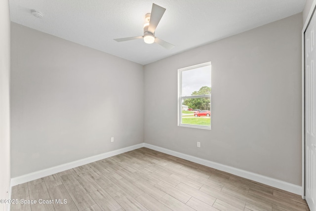 1427 Damon Rd SE, Palm Bay, FL 32909 - spare room featuring ceiling fan, baseboards, light wood-style floors, and a smoke detector
