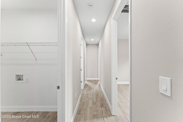 1427 Damon Rd SE, Palm Bay, FL 32909 - hallway with light wood-type flooring, baseboards, and recessed lighting