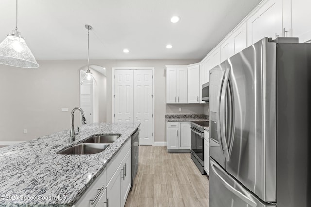 1427 Damon Rd SE, Palm Bay, FL 32909 - kitchen with stainless steel appliances, a sink, white cabinetry, recessed lighting, and baseboards