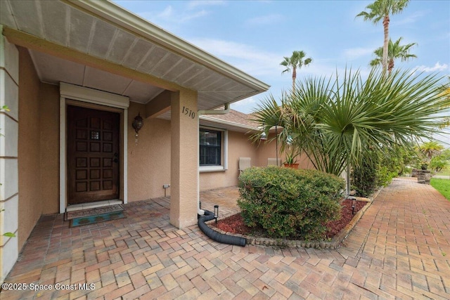 1510 Jupiter Blvd NW, Palm Bay, FL 32907 - entrance to property with stucco siding