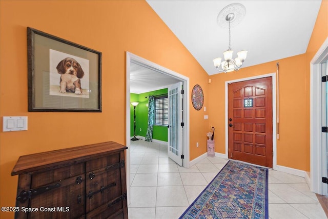 1510 Jupiter Blvd NW, Palm Bay, FL 32907 - foyer entrance featuring a chandelier, lofted ceiling, light tile patterned flooring, and baseboards