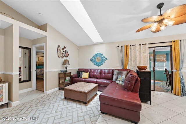 1510 Jupiter Blvd NW, Palm Bay, FL 32907 - living area with a skylight, light tile patterned floors, a ceiling fan, and baseboards