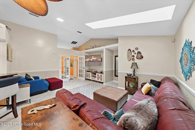 1510 Jupiter Blvd NW, Palm Bay, FL 32907 - tiled living room featuring a skylight and lofted ceiling