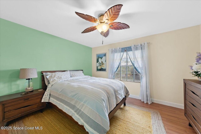 1510 Jupiter Blvd NW, Palm Bay, FL 32907 - bedroom with wood finished floors, baseboards, and a ceiling fan