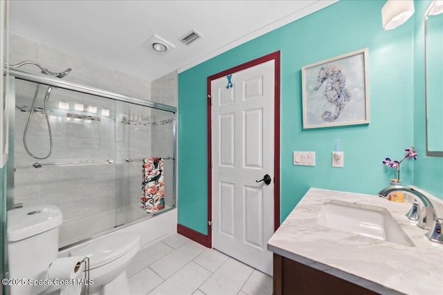 1510 Jupiter Blvd NW, Palm Bay, FL 32907 - full bath featuring toilet, vanity, combined bath / shower with glass door, and tile patterned flooring