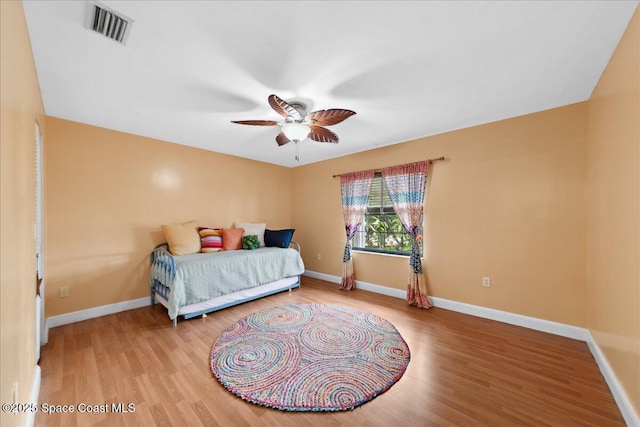 1510 Jupiter Blvd NW, Palm Bay, FL 32907 - bedroom with wood finished floors, baseboards, and ceiling fan
