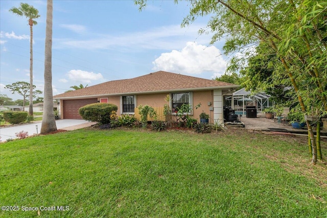 1510 Jupiter Blvd NW, Palm Bay, FL 32907 - single story home with a garage, stucco siding, a front lawn, driveway, and glass enclosure