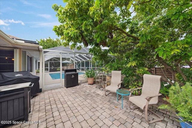 1510 Jupiter Blvd NW, Palm Bay, FL 32907 - view of patio / terrace featuring an outdoor pool, grilling area, and glass enclosure