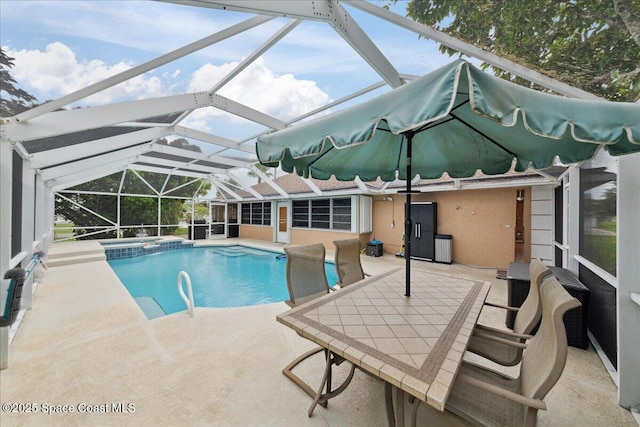 1510 Jupiter Blvd NW, Palm Bay, FL 32907 - view of swimming pool with a patio, a pool with connected hot tub, and glass enclosure