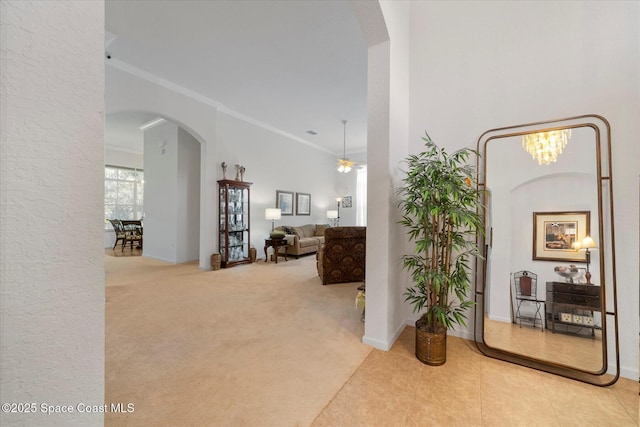 2770 Grand Isle Way SW, Vero Beach, FL 32968 - corridor featuring arched walkways, ornamental molding, and carpet
