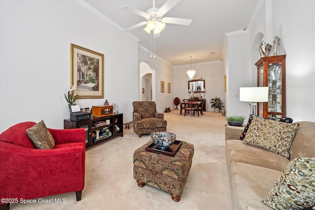 2770 Grand Isle Way SW, Vero Beach, FL 32968 - carpeted living room with crown molding, arched walkways, and ceiling fan