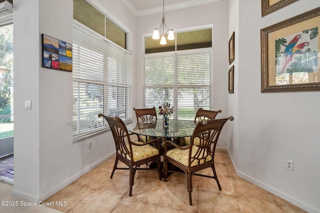 2770 Grand Isle Way SW, Vero Beach, FL 32968 - dining area with crown molding, a chandelier, and light tile patterned floors