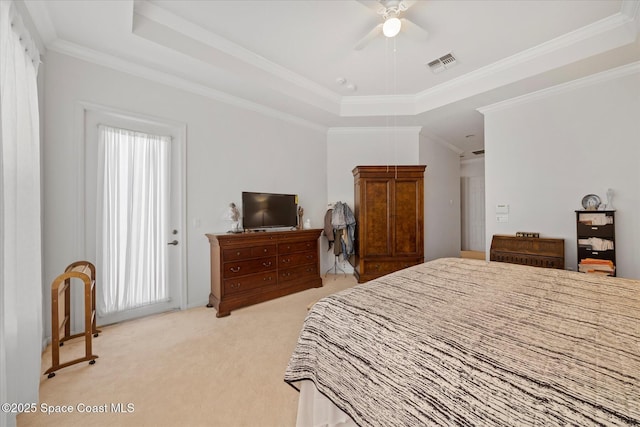 2770 Grand Isle Way SW, Vero Beach, FL 32968 - bedroom featuring a raised ceiling, light carpet, ornamental molding, and a ceiling fan