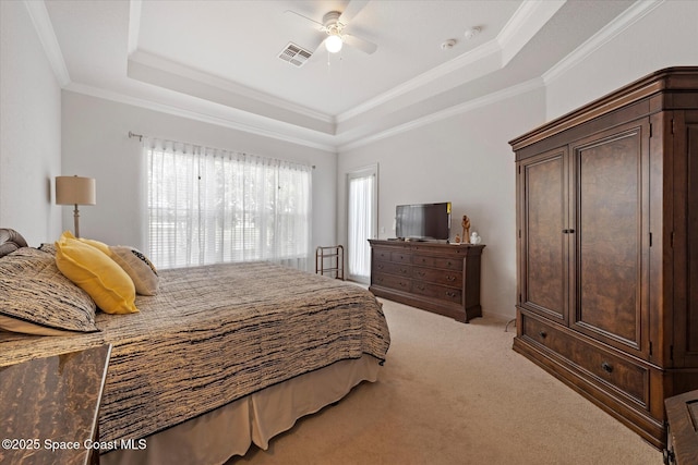 2770 Grand Isle Way SW, Vero Beach, FL 32968 - bedroom featuring a tray ceiling, light carpet, crown molding, and a ceiling fan