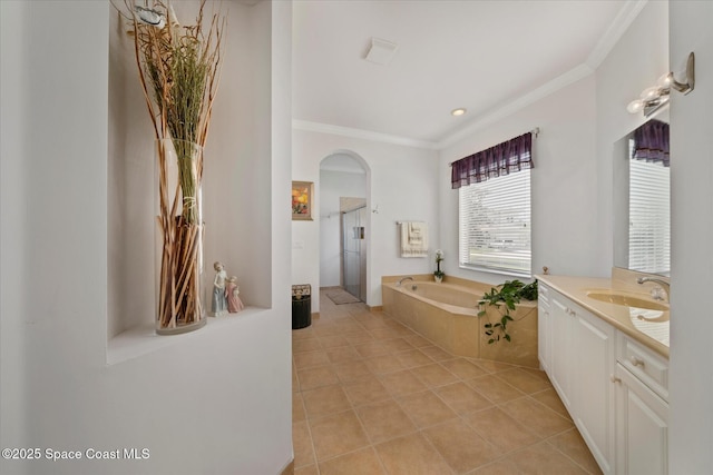 2770 Grand Isle Way SW, Vero Beach, FL 32968 - full bathroom with crown molding, vanity, a garden tub, a stall shower, and tile patterned flooring