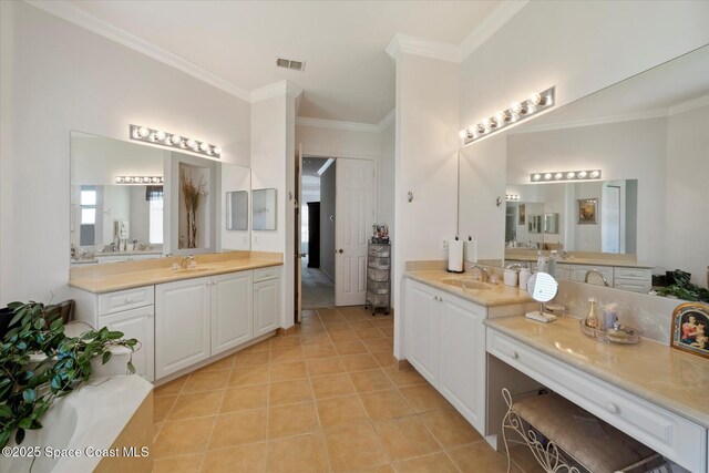 2770 Grand Isle Way SW, Vero Beach, FL 32968 - bathroom with ornamental molding, two vanities, and tile patterned flooring