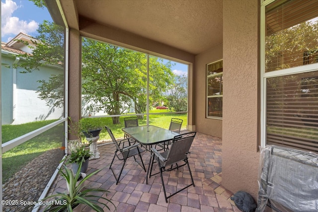 2770 Grand Isle Way SW, Vero Beach, FL 32968 - sunroom featuring outdoor dining space
