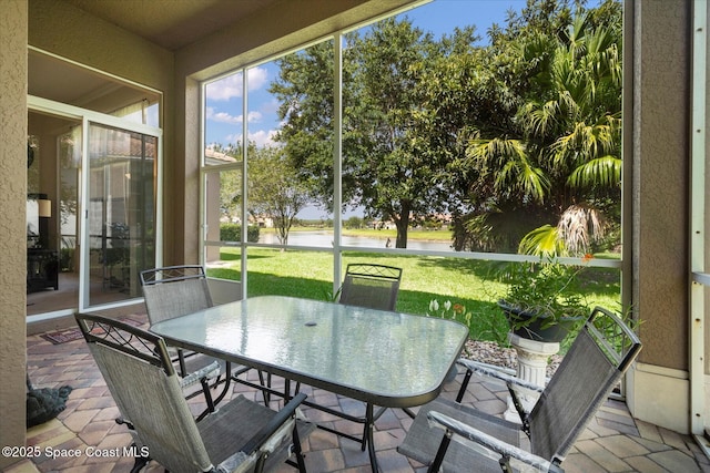 2770 Grand Isle Way SW, Vero Beach, FL 32968 - sunroom / solarium featuring a water view and outdoor dining space