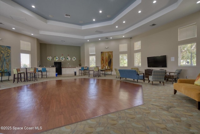 2770 Grand Isle Way SW, Vero Beach, FL 32968 - interior space featuring a tray ceiling, recessed lighting, a high ceiling, and wood finished floors